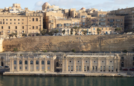 Historic harbor buildings along the Grand Harbour, Valletta, Malta