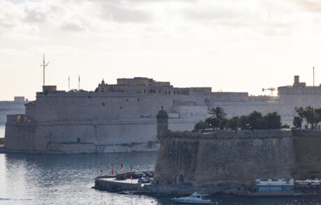 Fort St. Angelo and harbor fortifications at sunset, Valletta, Malta