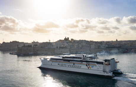 Ferry crossing the Grand Harbour at sunset, Valletta, Malta