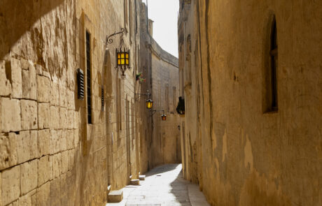 Narrow limestone alley in Mdina, Malta