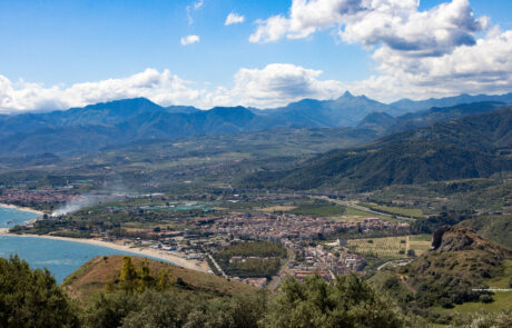Panoramic hillside view over a lake and valley near Tindari