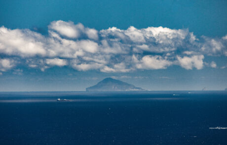 Sea view toward a distant island Isola de Panarea from Tindari, Sicily