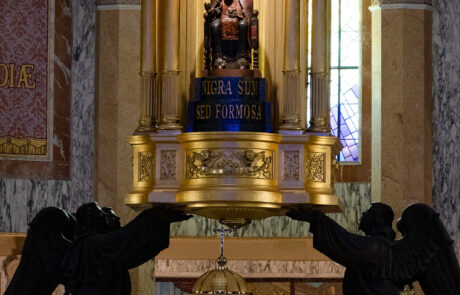 Ornate gilded altar with angel statues inside the Tindari basilica