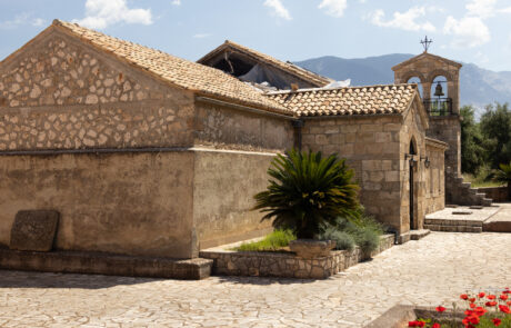 Stone monastery building with a bell tower at Kefalonia