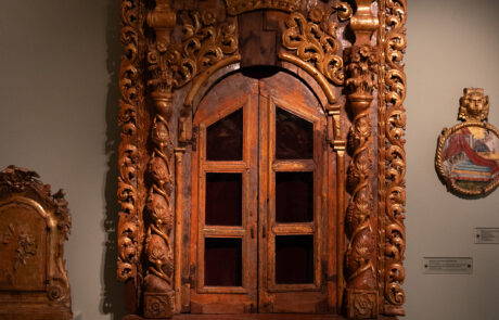 Ornate carved wooden iconostasis cabinet displayed at a Kefalonia monastery museum