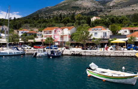 Harbor promenade with boats and waterfront buildings at Agia Effimia, Kefalonia