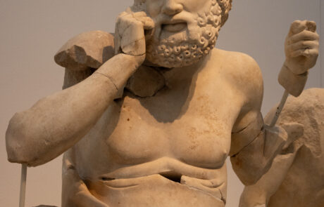Marble pediment sculpture of a male figure at the Olympia Archaeological Museum