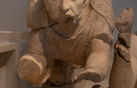 Marble statue of a draped female figure with flowing robes at the Olympia Archaeological Museum
