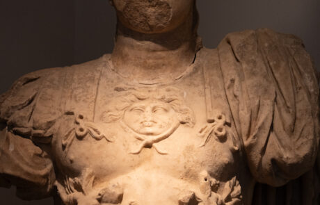 Marble bust of a wreathed Roman-era figure at the Olympia Archaeological Museum