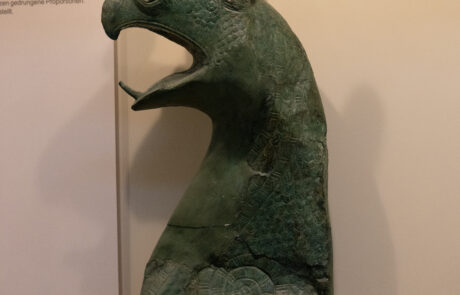 Bronze griffin-head statue displayed at the Olympia Archaeological Museum