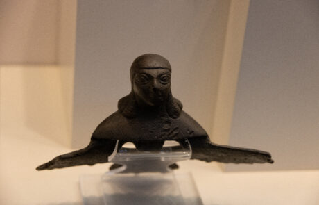 Bronze war helmet with cheek guards at the Olympia Archaeological Museum