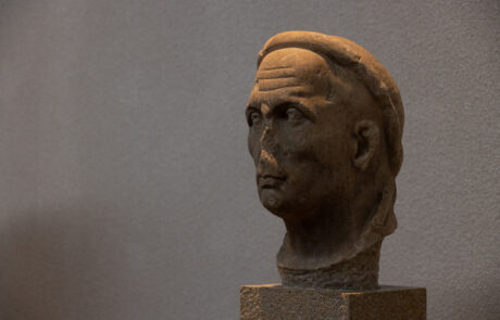 Close-up of an ancient marble portrait bust at the Olympia Archaeological Museum