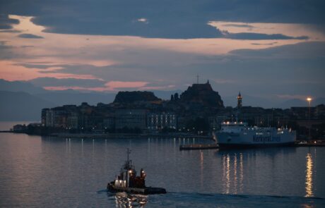 Evening view of Corfu Old Fortress and the harbor at dusk