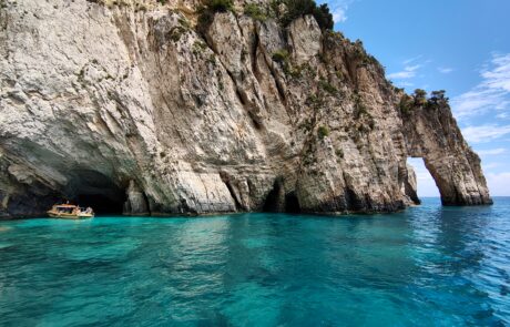 Turquoise sea cave beneath white limestone cliffs at the Zakynthos Blue Caves