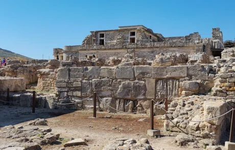 Ancient stone ruins and excavated walls at the Knossos archaeological site