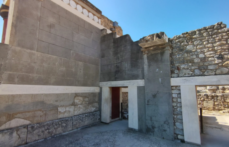 Excavated stone building ruins with restored walls at the Palace of Knossos