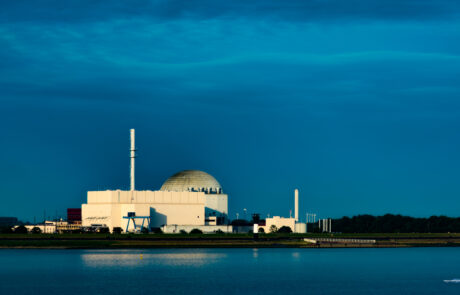 Illuminated powerplant building at the waterfront at night, Hamburg