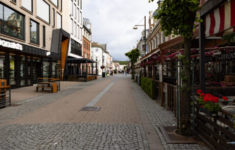 Pedestrian shopping street lined with cafes, Kristiansand, Norway