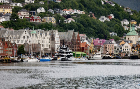 Colorful hillside houses viewed from the harbor with boats, Bergen, Norway