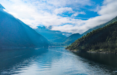 Narrow deep-blue fjord between steep mountains, Geiranger, Norway