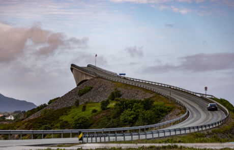 The Atlantic Ocean Road curving over the water at dusk, Norway