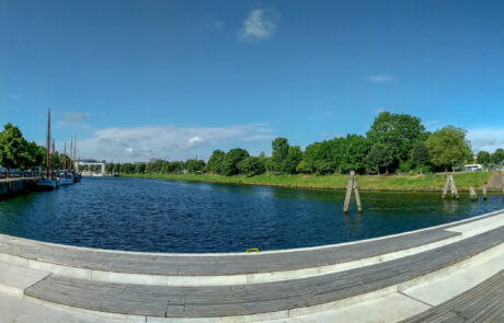 Panoramic daytime view of the Drehbrueckenplatz harbor with the swing bridge and canal