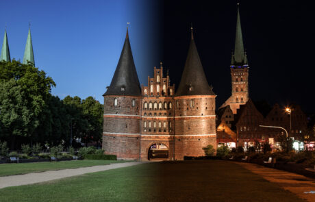 Split day-and-night composite image of Luebecks Holstentor gate
