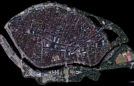 3D-rendered top-down map of Luebecks old town island against a dark background