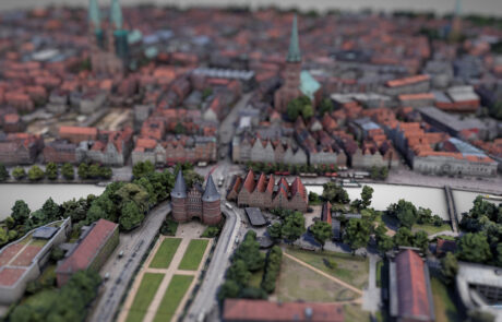3D-rendered oblique aerial view of Luebecks old town island with detailed buildings