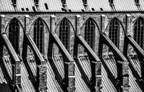 Black-and-white close-up of the Gothic buttresses and arches of St. Marien church, Luebeck