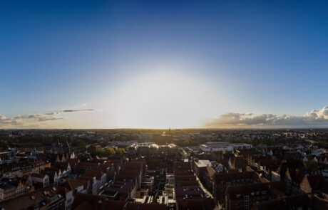 Panoramic view over Luebecks rooftops at sunset from St. Marien church tower