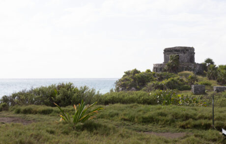 Mayan stone temple with columns and a doorway, Tulum
